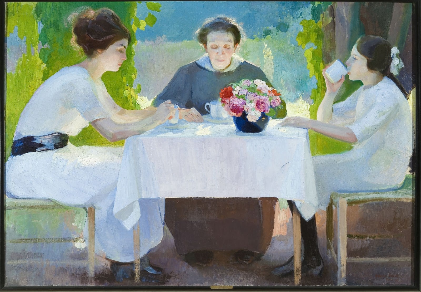 Oil painting, Morning Breakfast, La colazione del mattino, by Amedeo Bocchi, 1919. Galleria Ricci Oddi, Piacenza. Three women dressed in white are positioned around a breakfast table covered with a white tablecloth in an outdoor garden setting with green foliage and sunlight. An older woman sits in the center facing left, a younger woman sits on the left in profile, and a young girl sits on the right facing forward.