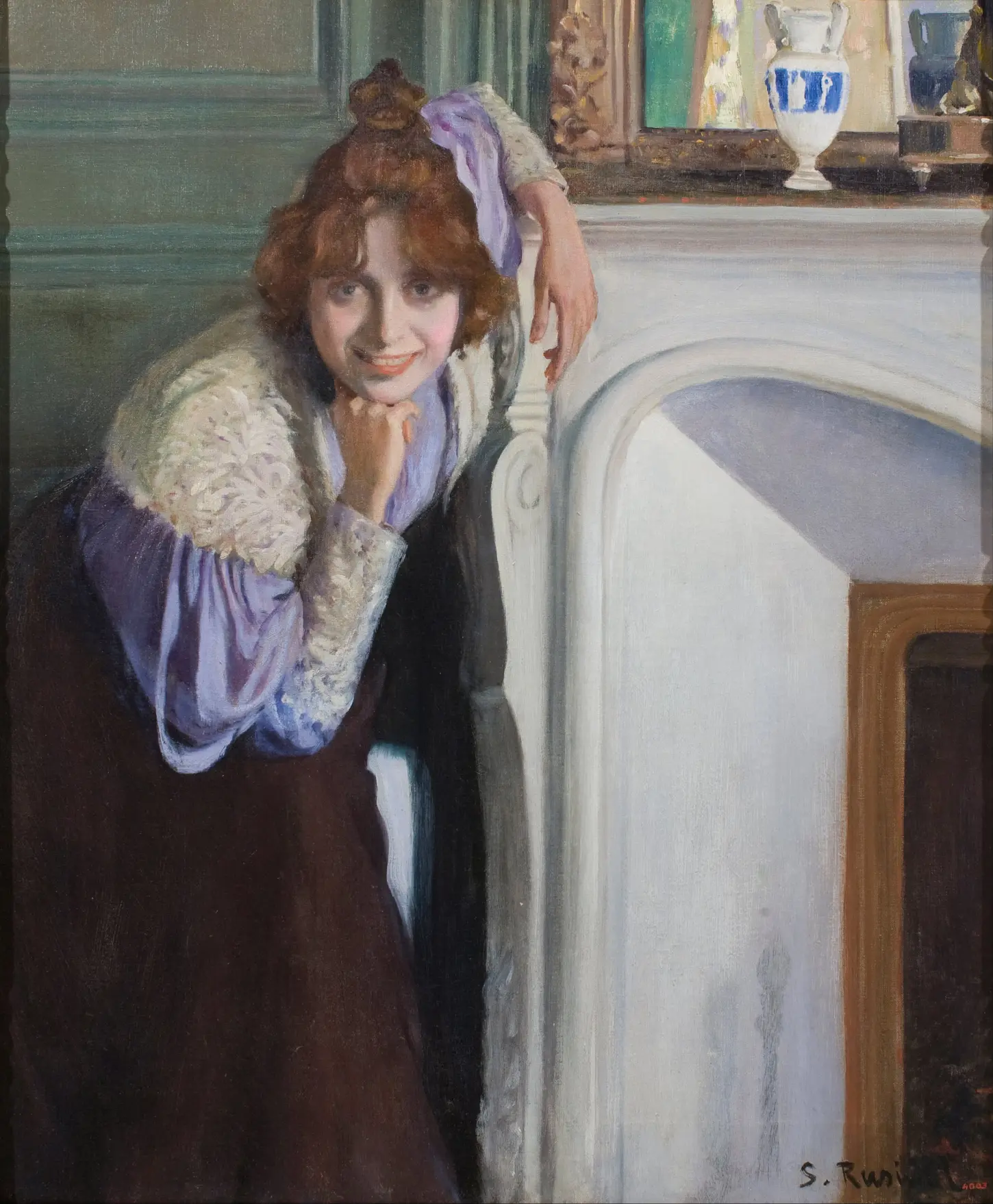 Oil on canvas, Laughing Girl, La riallera, by Santiago Rusiñol, 1894. Museu Nacional d'Art de Catalunya. A view of a woman with red hair tied back, wearing a blue and white patterned dress, seated at a wooden table against a dark interior background.